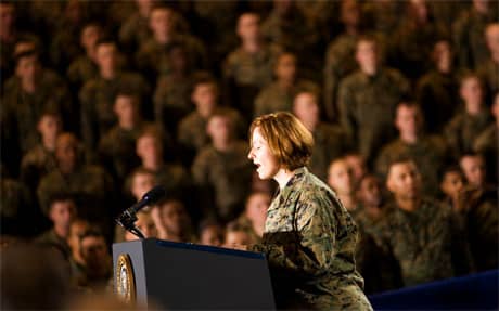 Marine Corps Combat Correspondent, Staff Sgt. Angela Mink, performs the National Anthem prior to President Barack Obamas address to Camp Lejeune troops, Feb. 28, 2009. Photo by Ena Sellers, The Globe